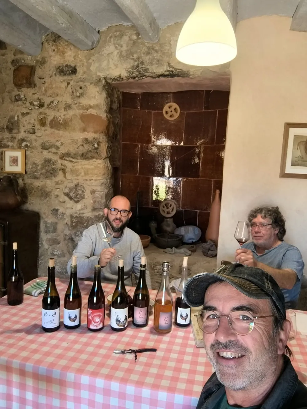 Natural wine tasting at Carles Llarch's home in Font-Rubí, with bottles on a table